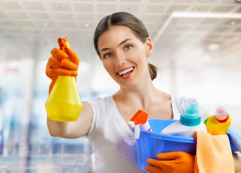 Professional cleaner working in a property during service delivery