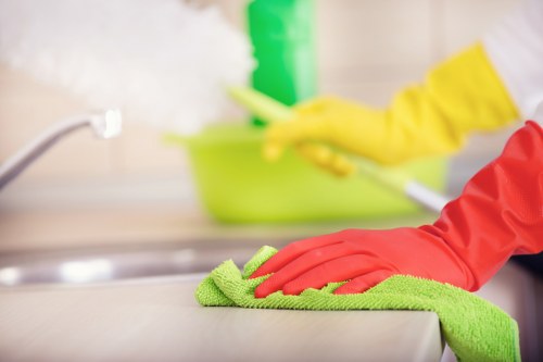 Supervisor reviewing safety practices for a cleaning task