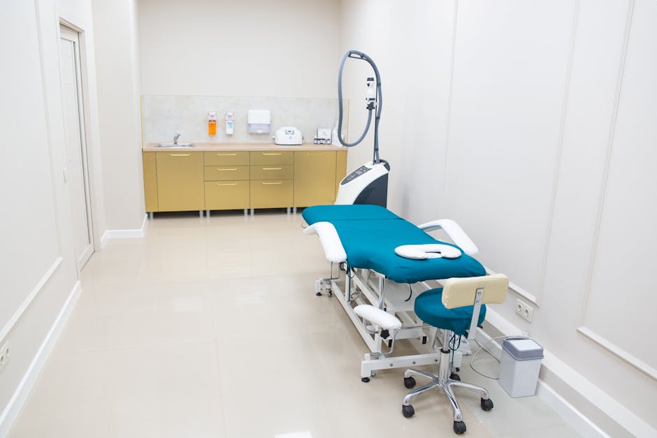 A healthcare professional wearing white disposable gloves is seen putting on another glove in a clinical setting, with a focus on the gloved hands. The background features a sterile environment with l