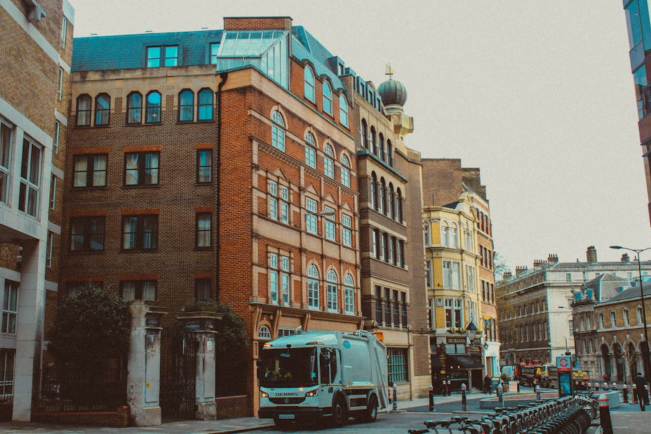 A street sign on the exterior wall of a building in Marylebone displays 'BELL YARD WC2' with a smaller sign beneath indicating '24 hour CCTV in operation, Flytippers will be prosecuted.' The wall is m